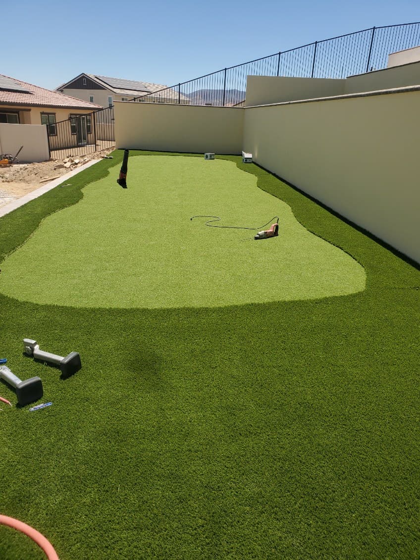 Backyard artificial turf putting green under construction