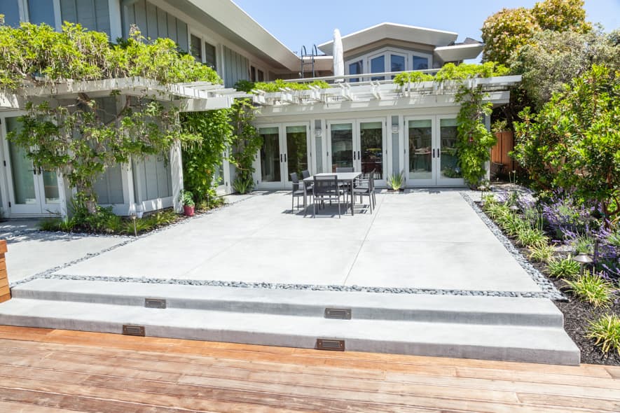Broom finish concrete patio with integrated steps